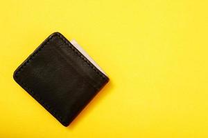 Wallet with Plan your finances in advance, such as having 3-6 months of savings, buying insurance, and generating income in many ways. debt planning photo