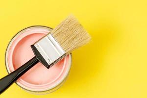 Paint cans and paint brushes and how to choose the perfect interior paint color and good for health photo