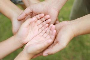 Children's hands with the warmth of mother's care photo