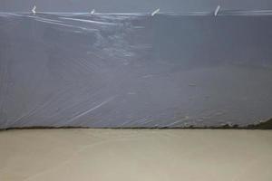 Clear plastic for curing concrete floors. photo