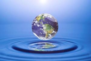 world concept and resources Water, water management. globe floating on water photo