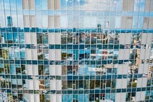 Street reflection on glass steel building facade photo