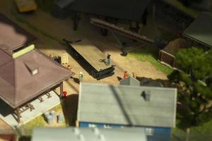 Miniature houses. Model of a rural settlement. Toy city. Buildings made of plastic. photo