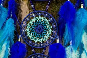 Handmade dream catcher with feathers threads and beads rope hanging photo