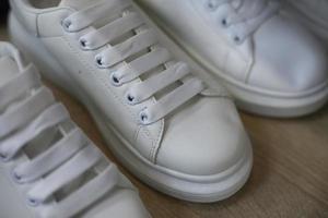 White shoes. Chinese cheap shoes in the store. photo