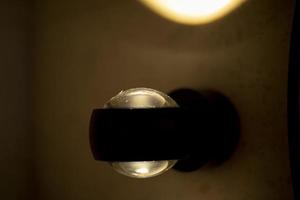 Interior details. Glass ball in the light of a lamp. photo