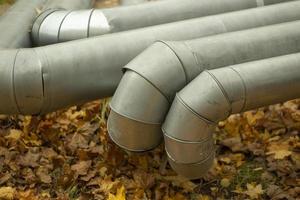 Bending of pipes. Industrial stainless steel pipes. Industry details. photo