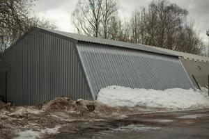 Metal warehouse outside. Storage room for municipal equipment. photo