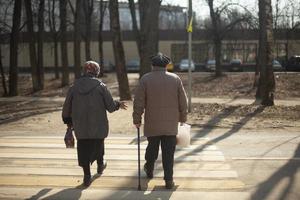 Retired grandmothers walk through the pedestrian crossing. photo