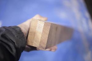 Wooden block in hand photo