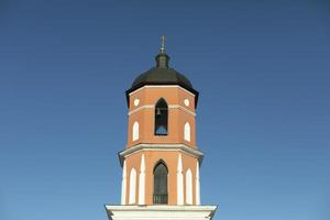 Bell tower of temple. Orthodox church. Religious building. photo