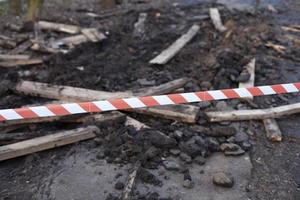 The tape encloses a hole in the road. Roads in Russia. photo