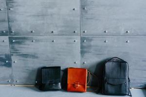 three leather bags on a gray background photo
