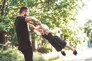 Dad and little daughter have fun and playing photo