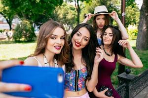 four beautiful young girls make selfie photo