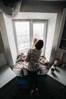 Mother and her daughter girl play in kids room photo