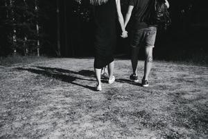 beautiful couple standing in a forest photo