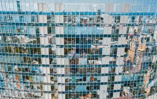 Street reflection on glass steel building facade photo