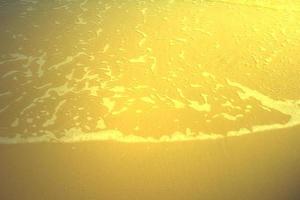 Shiny gold beach texture,abstract background,golden pattern photo