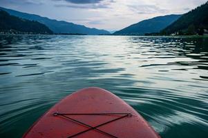 red Sup board cut out on lake Ossiach in Austria photo