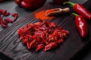 Pieces of dried paprika, preparation of powder spice for various dishes photo