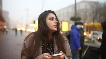 Woman walking on busy street at evening video