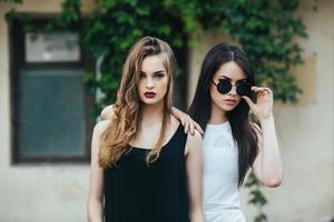 Two beautiful young girls in dresses photo