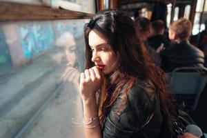 Woman traveling inside the tram photo