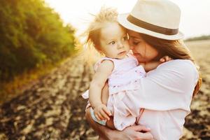 mother and daughter together outdoors photo