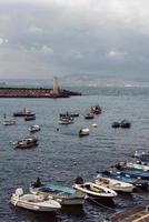 Berth with boats on sea shore photo