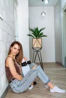 Cute, attractive woman with skateboard photo