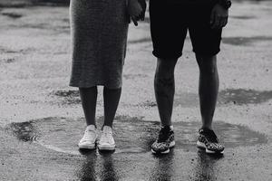 couple on the background of wet asphalt photo