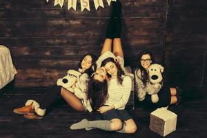 Four charming model posing on a vintage New Year's background photo