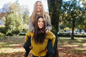 Two girls having fun in the park photo