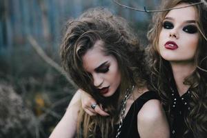 Two vintage witches gathered eve of Halloween photo