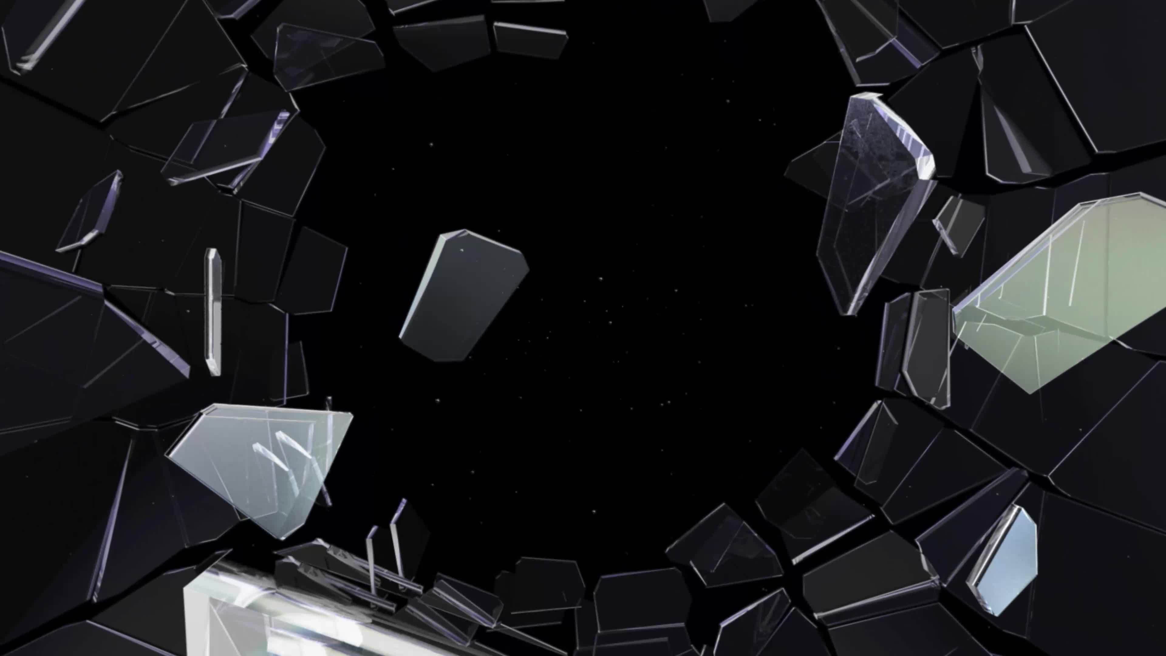 Shattered and broken glass shards flying through the air after crush