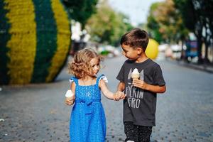 little boy and little girl with ice cream photo