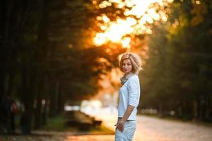 beautiful girl in sunset light photo