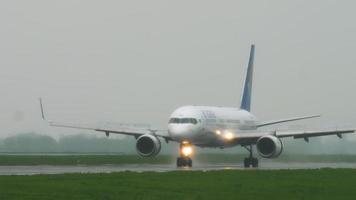 ALMATY, KAZAKHSTAN MAY 4, 2019 - Air Astana Boeing 757 P4 GAS braking after landing on runway at rainy weather. Airport of Almaty, Kazakhstan video