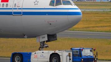 FRANKFURT AM MAIN, GERMANY JULY 17, 2017 Air China Boeing 777 B 2088 towing by tractor from service. Fraport, Frankfurt, Germany
