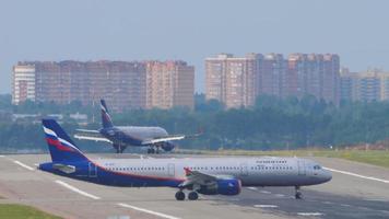 MOSCOW, RUSSIAN FEDERATION SEPTEMBER 12, 2020 - Aeroflot Russian Airlines Airbus 321 VP-BOC taxiing to the runway to depart from Sheremetyevo airport and Aeroflot Airbus A320 taxiing from the runway video