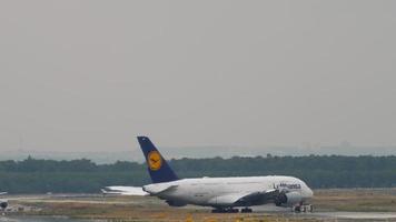 FRANKFURT AM MAIN, GERMANY JULY 18, 2017 - The tractor tows Lufthansa Airbus 380 from service. Fraport, Frankfurt, Germany video