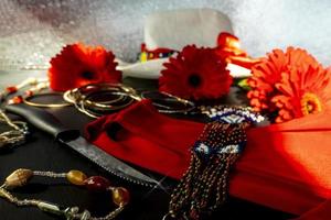 set of red, white and colorful fashion accessories on a black background photo