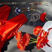 set of red, white and colorful fashion accessories on a black background photo