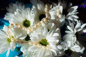 white flowers bouquet closeup dark background photo