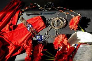 set of red, white and colorful fashion accessories on a black background photo