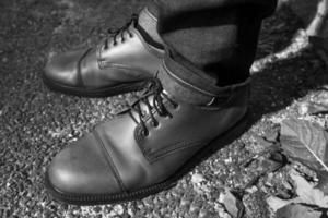 Feet of Men  in selvedge jeans and retro shoes photo