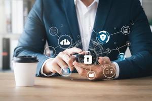Cybersecurity and privacy concepts to protect data. Lock icon and internet network security technology. Businessmen protecting personal data on smartphone and virtual interfaces. photo