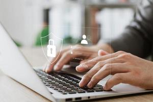 Cybersecurity and privacy concepts to protect data. Lock icon and internet network security technology. Businessmen protecting personal data on laptop and virtual interfaces. photo