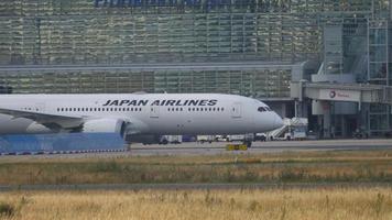 FRANKFURT AM MAIN, GERMANY JULY 19, 2017 - Japan Airlines Boeing 787 taxiing to the runway. Tourism and travel concept. Airplane at the airport. Loaded Flight Traffic video